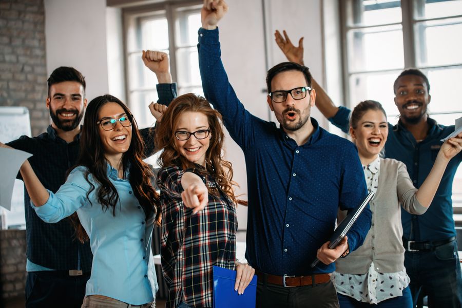 Image of people in an office celebrating